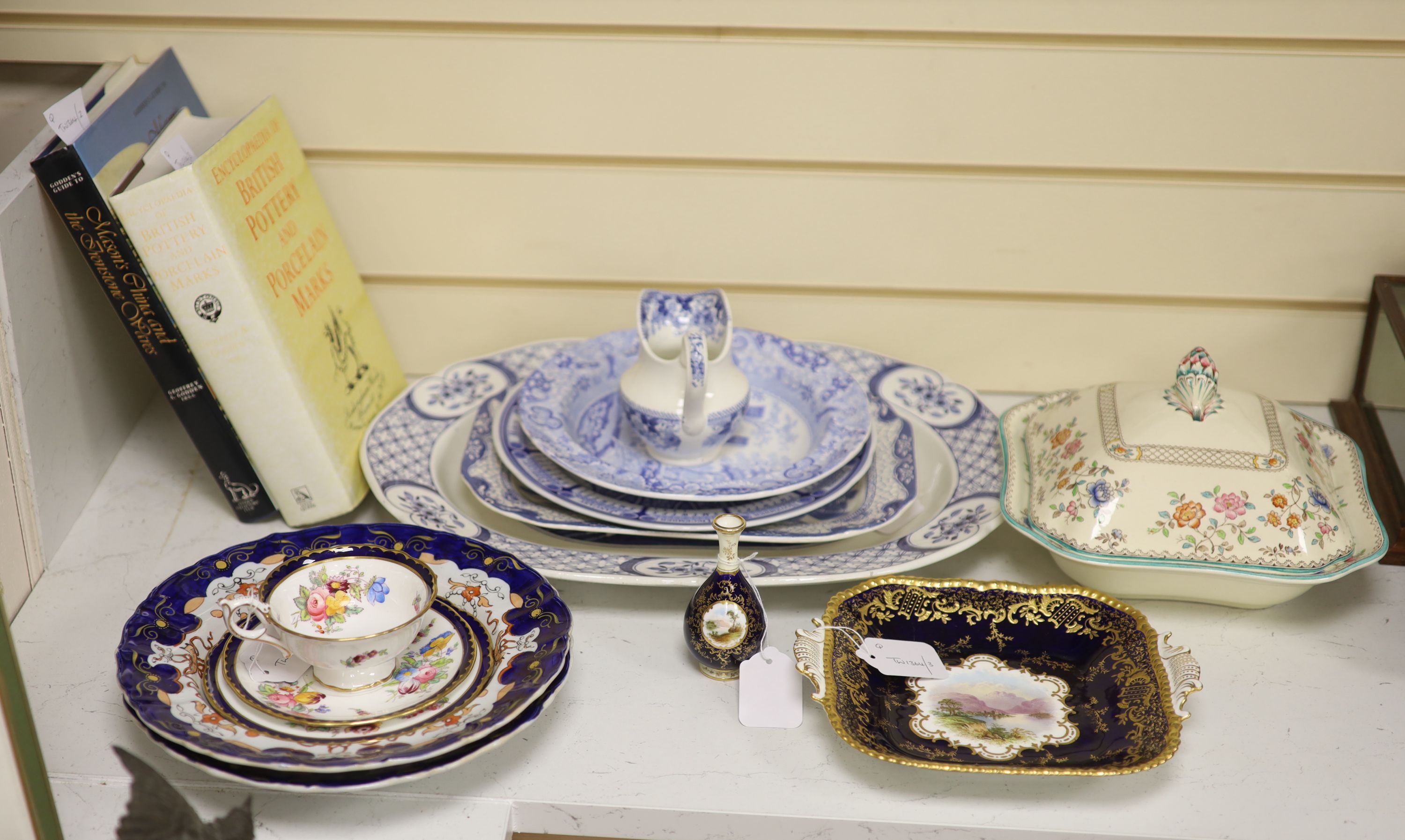 A Coalport cobalt blue dish with painted reserve of Kilchurn, heightened in gilt and sundry ceramics,